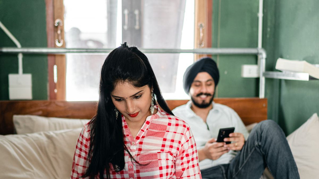 Indian couple relaxing on a bed, beginner guide to sex toys for men in India